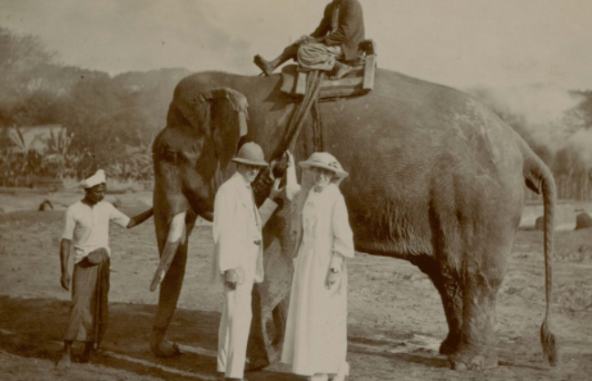 Couple in front of elephant in Burma