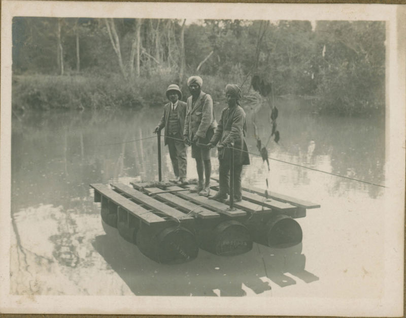 Three men on a raft